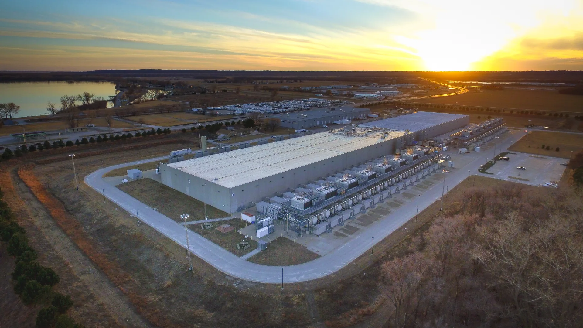 Aerial view of Google’s data center in Council Bluffs, Iowa, with rows of cooling equipment and neighboring buildings.