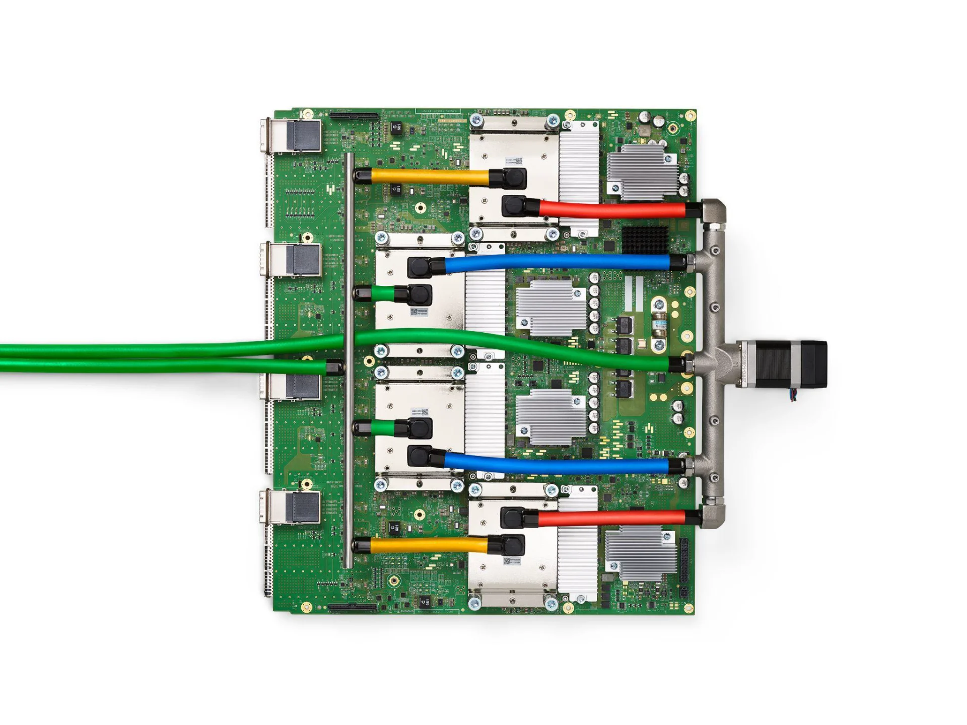 A green TPU v4 circuit board with four liquid-cooled packages and colored tubes.