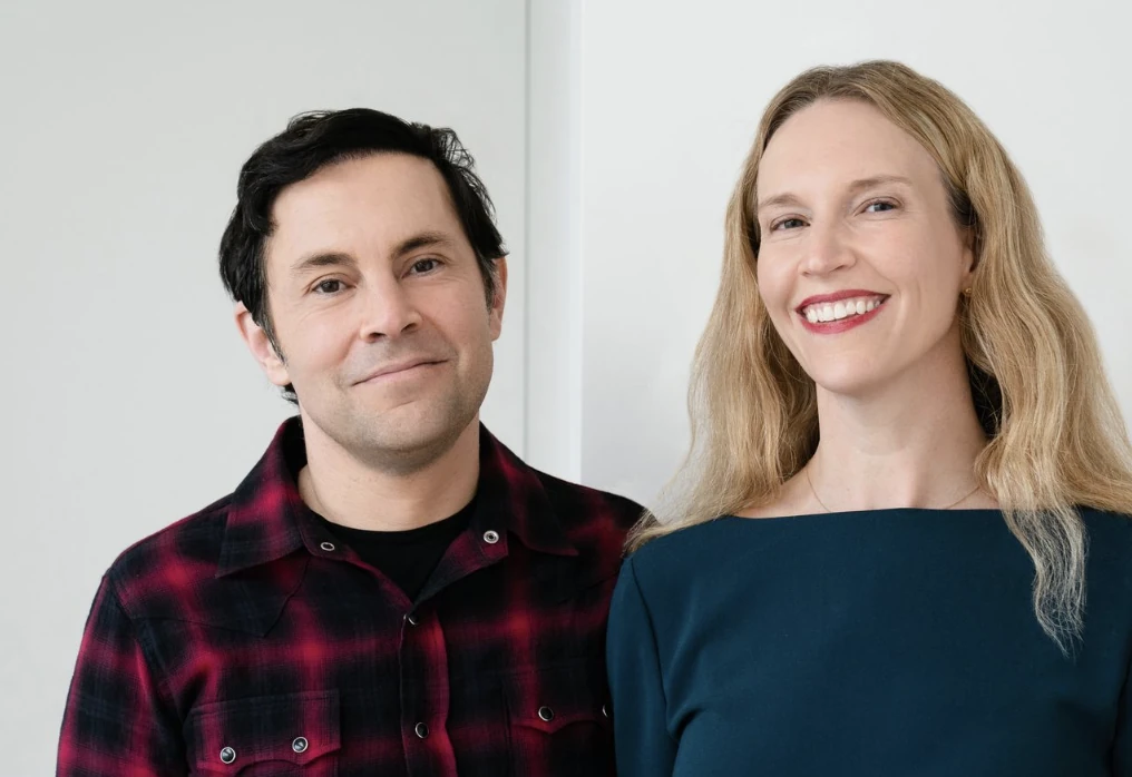 AudioShake co-founders Luke Miner, left, and Jessica Powell standing together in a company portrait.